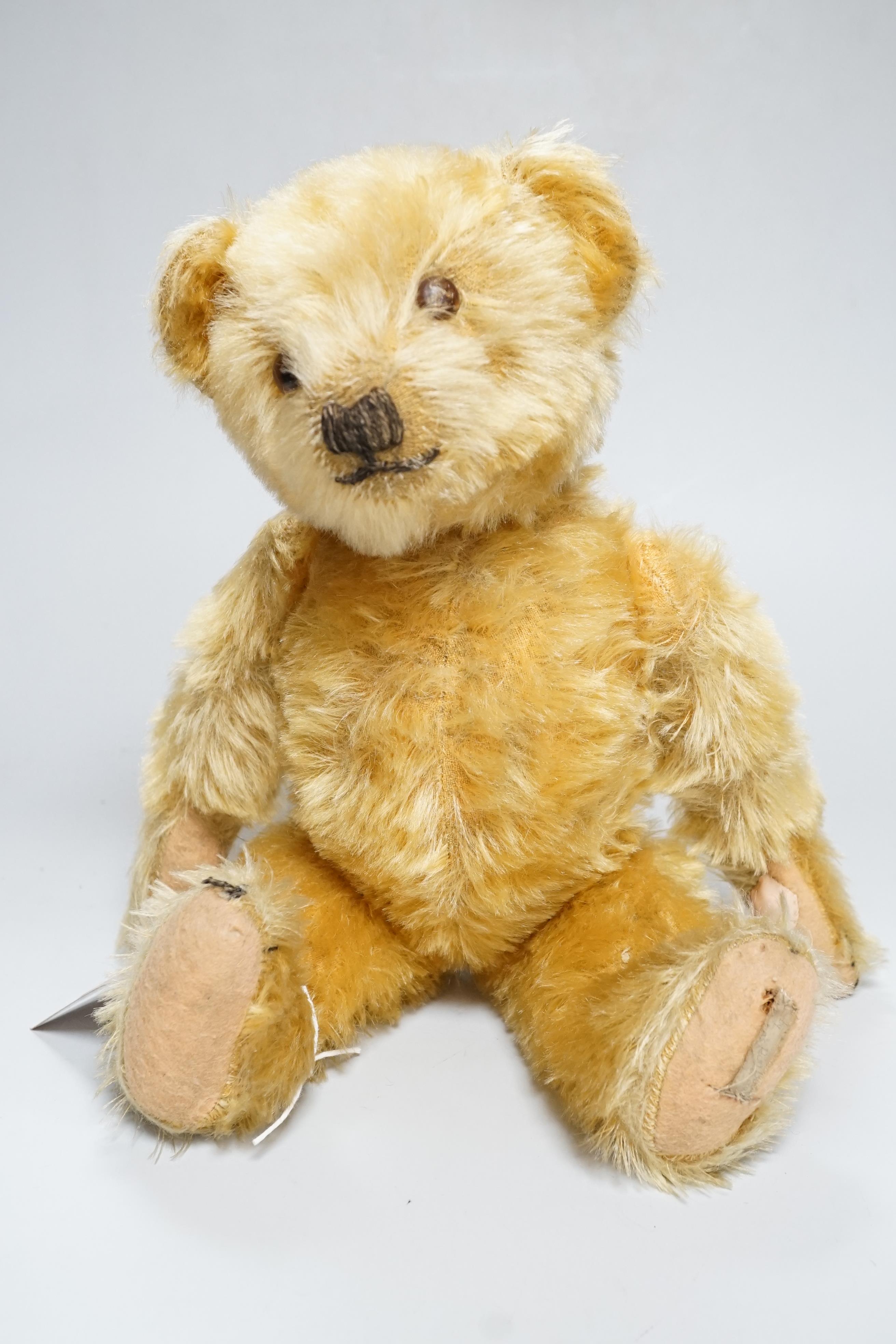 A Deans 1950's mouse eared bear, label on left foot, 16in., repair to paw pads, good mohair